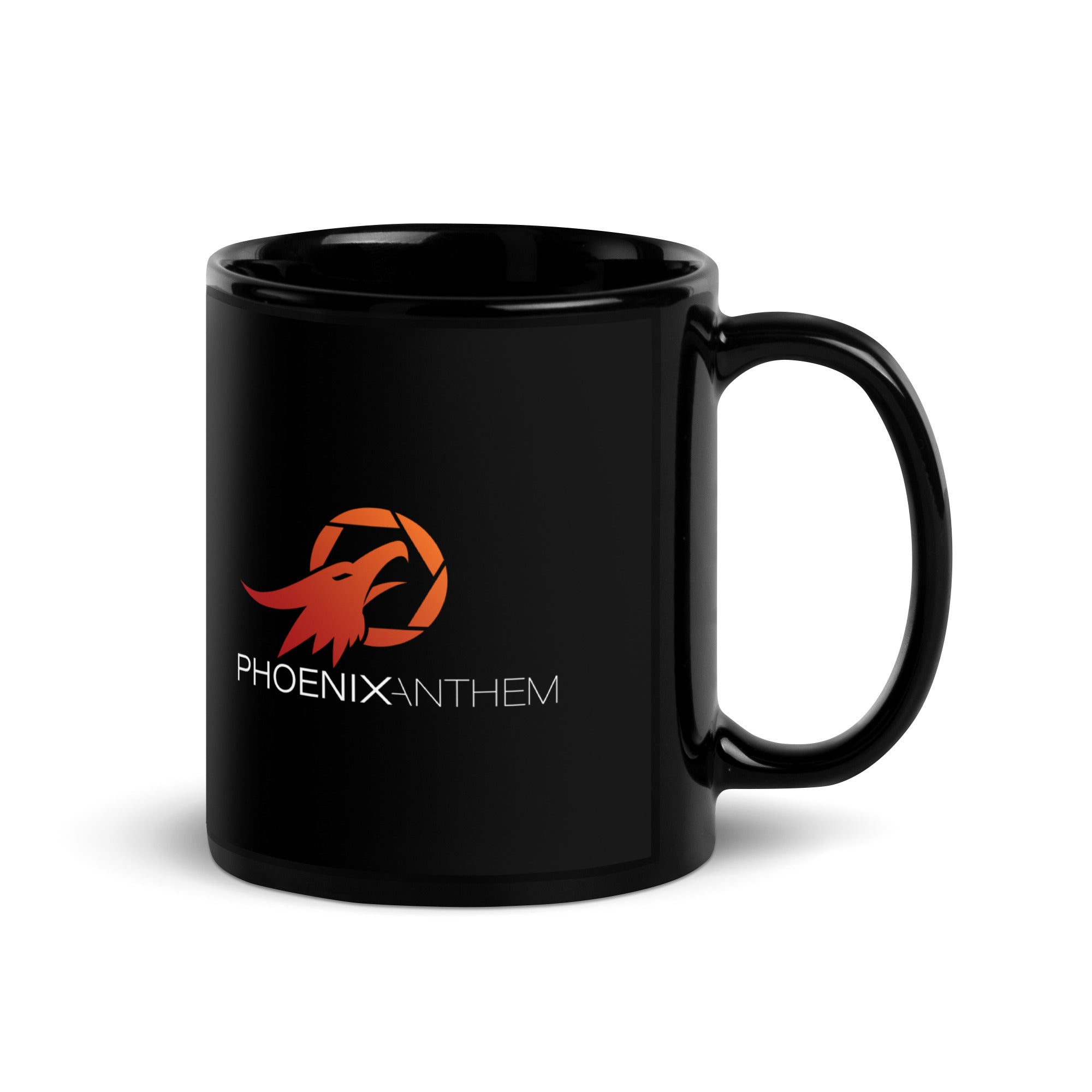 right-handle view of the Phoenix Anthem glossy black mug. A striking ceramic design with red-orange logo and a smooth finish that reflects bold faith and craftsmanship.