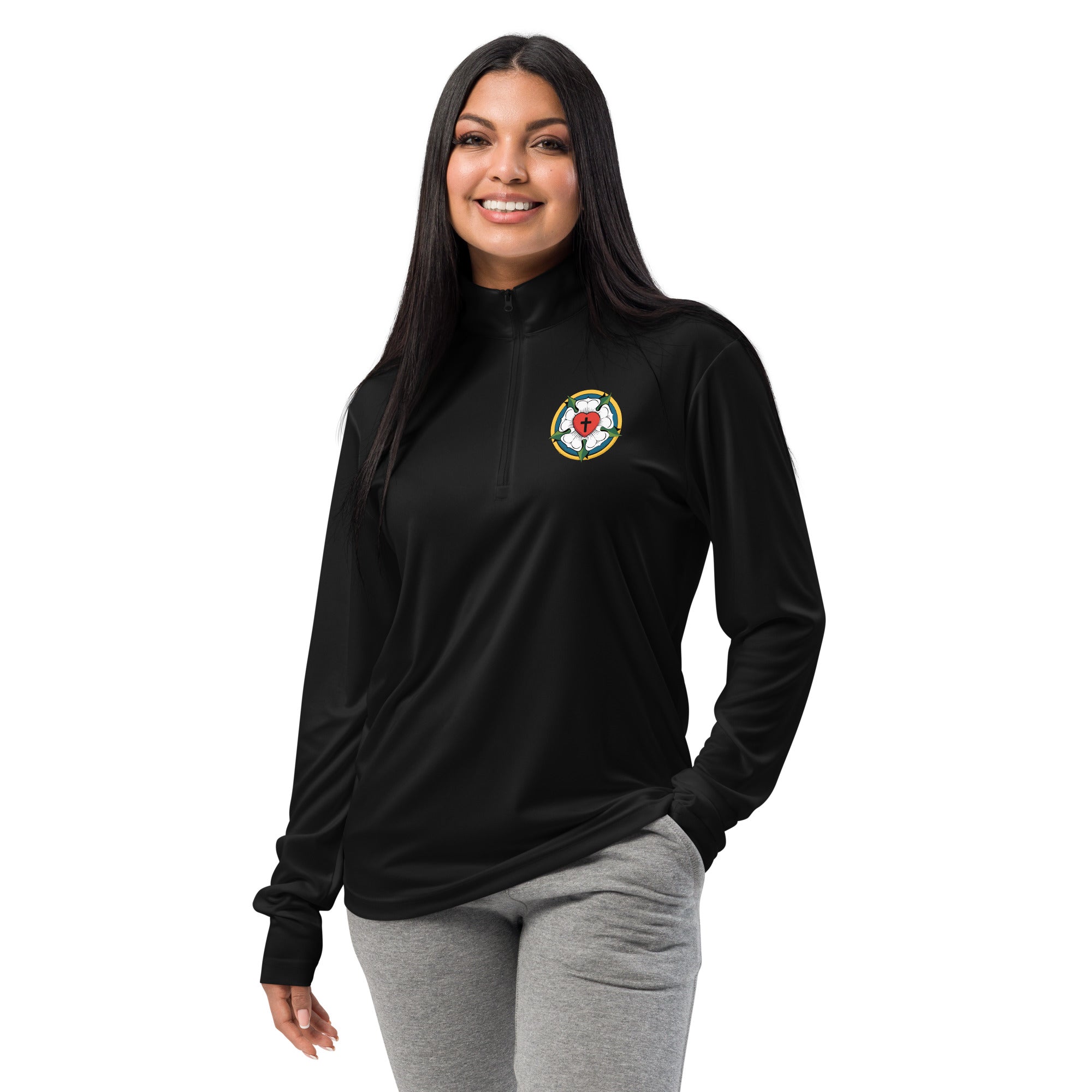 Close-up front view of a woman smiling and wearing the unisex black lightweight quarter-zip pullover showcasing the clean placement of the embroidered Luther Rose symbol.