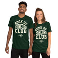 A man and woman modeling matching emerald tri-blend t-shirts featuring a collegiate "Book of Concord Club Est. 1580" graphic design. Premium Lutheran apparel and Christian theology clothing for men and women.