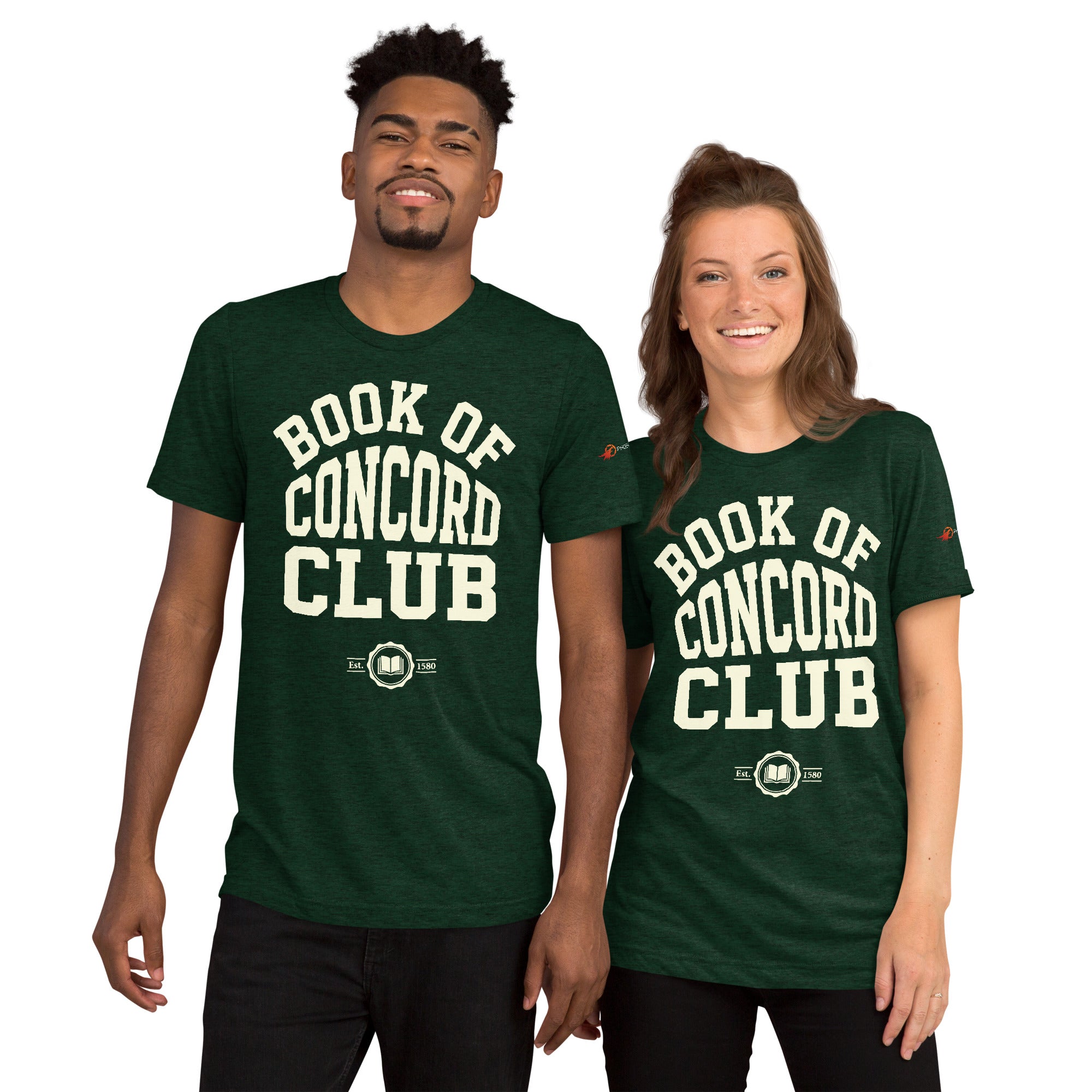 A man and woman modeling matching emerald tri-blend t-shirts featuring a collegiate "Book of Concord Club Est. 1580" graphic design. Premium Lutheran apparel and Christian theology clothing for men and women.