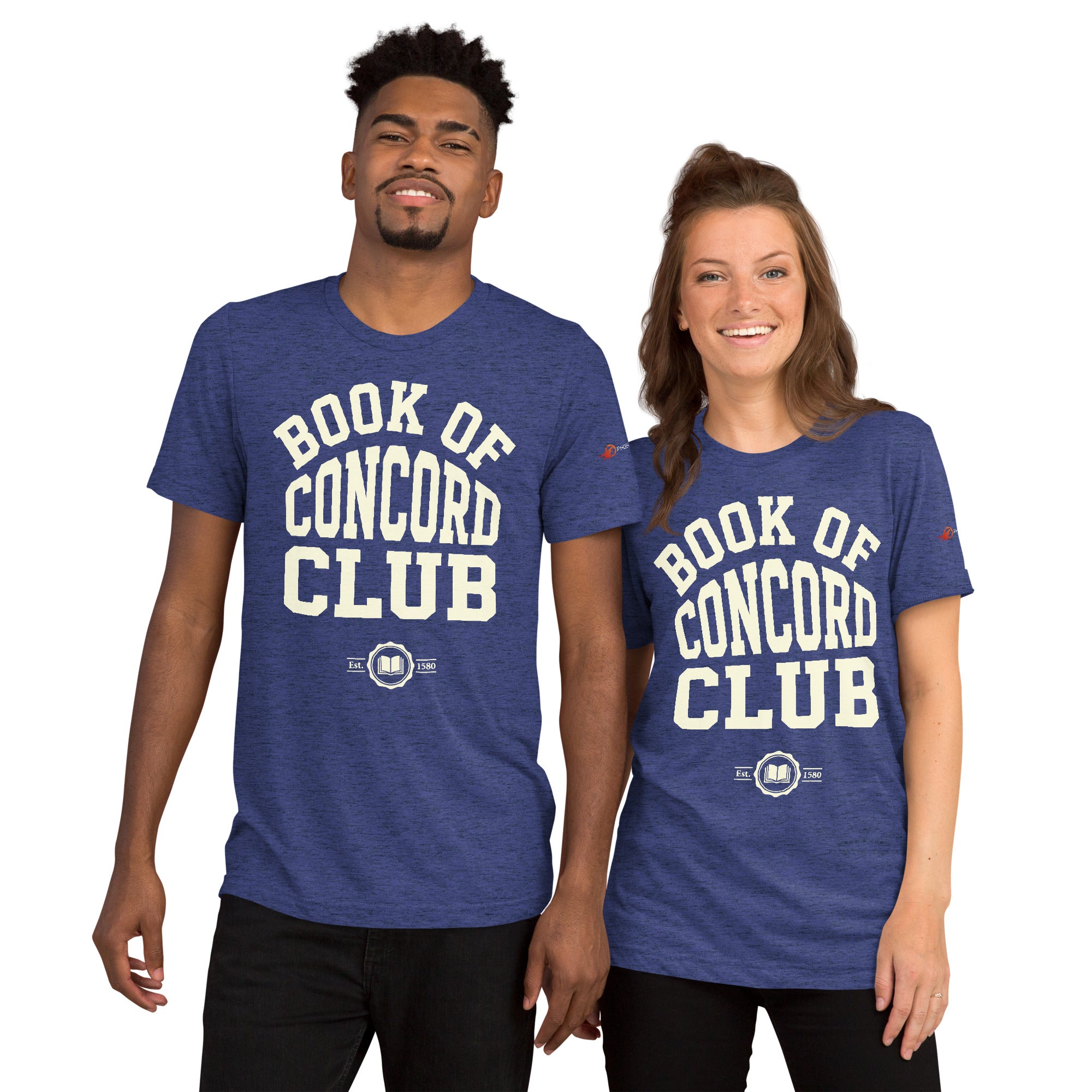 A man and woman modeling matching navy tri-blend t-shirts featuring a collegiate "Book of Concord Club Est. 1580" graphic design. Premium Lutheran apparel and Christian theology clothing for men and women.