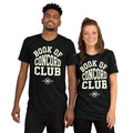 A man and woman modeling matching black tri-blend t-shirts featuring a collegiate "Book of Concord Club Est. 1580" graphic design. Premium Lutheran apparel and Christian theology clothing for men and women.