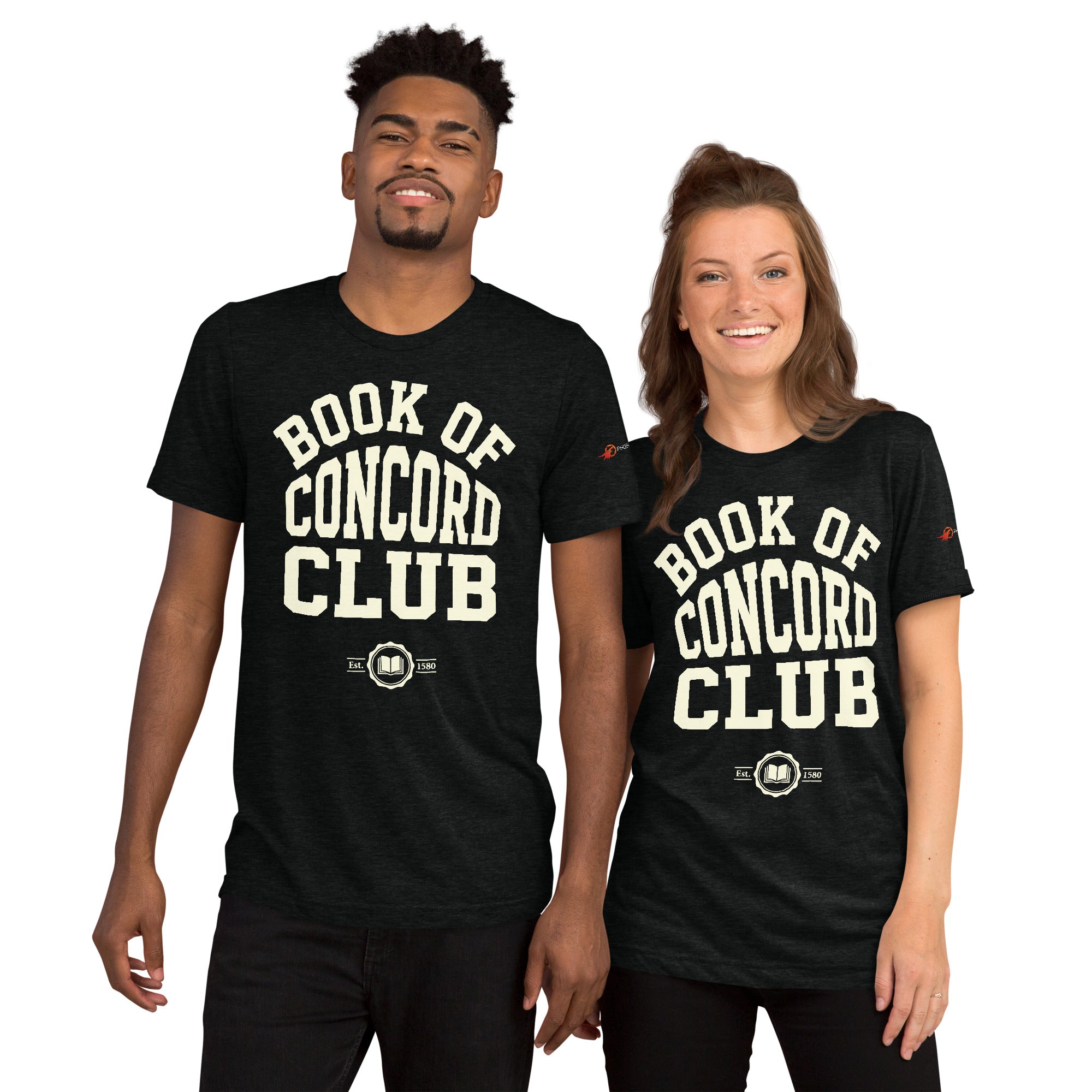 A man and woman modeling matching black tri-blend t-shirts featuring a collegiate "Book of Concord Club Est. 1580" graphic design. Premium Lutheran apparel and Christian theology clothing for men and women.