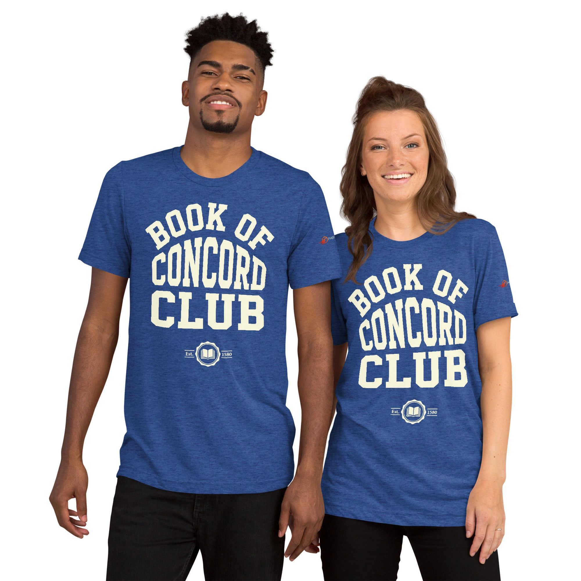 A man and woman modeling matching true royal tri-blend t-shirts featuring a collegiate "Book of Concord Club Est. 1580" graphic design. Premium Lutheran apparel and Christian theology clothing for men and women.