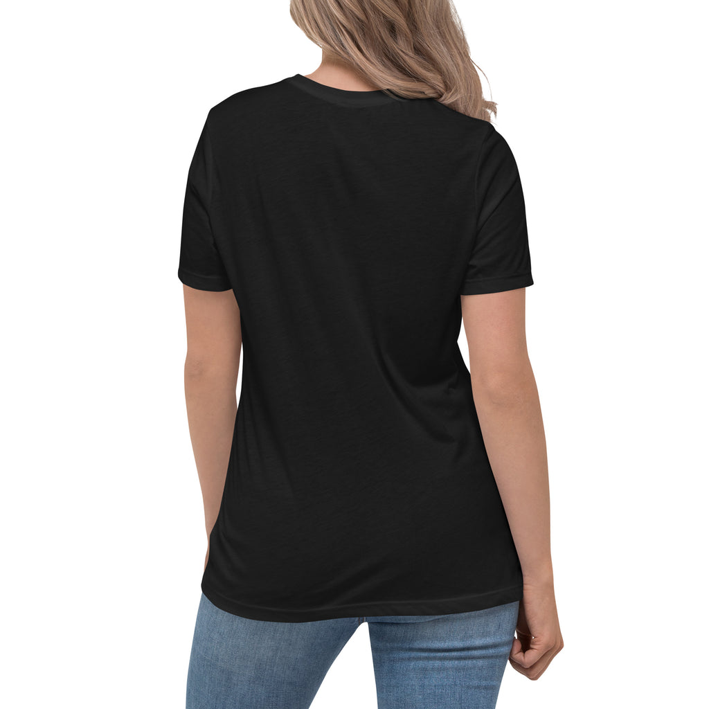 Rear view of a blonde woman wearing a black relaxed-fit Christian t-shirt with blue jeans. Clean plain back profile view of high-quality women's faith-based apparel from Phoenix Anthem.