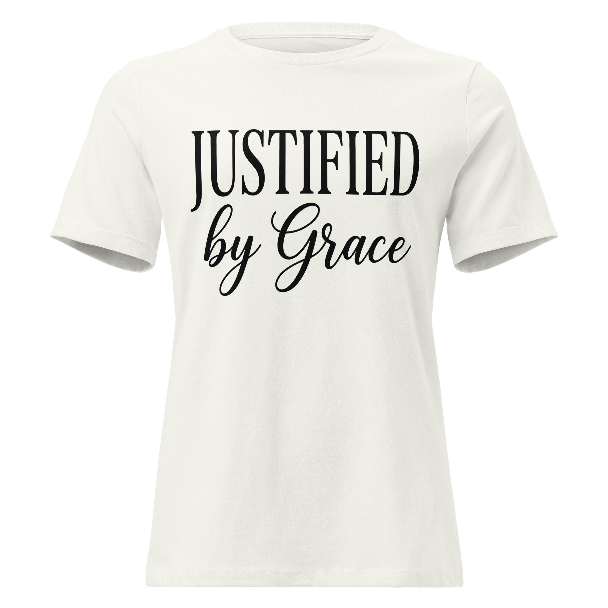 Front view of a vintage white women's relaxed-fit Christian t-shirt with black text reading 'JUSTIFIED by Grace' in a clean serif and script font combination. Premium Lutheran faith-based apparel from Phoenix Anthem.